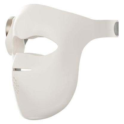 A white LED facial therapy mask with eye, nose, and mouth cutouts, shown from a side profile view against a plain white background.
