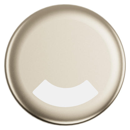 A circular metallic paint swatch in a champagne gold finish, featuring a white curved cutout at the bottom.