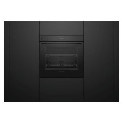 A sleek, black built-in wall oven with a glass door and interior rack, set into matching black kitchen cabinetry.