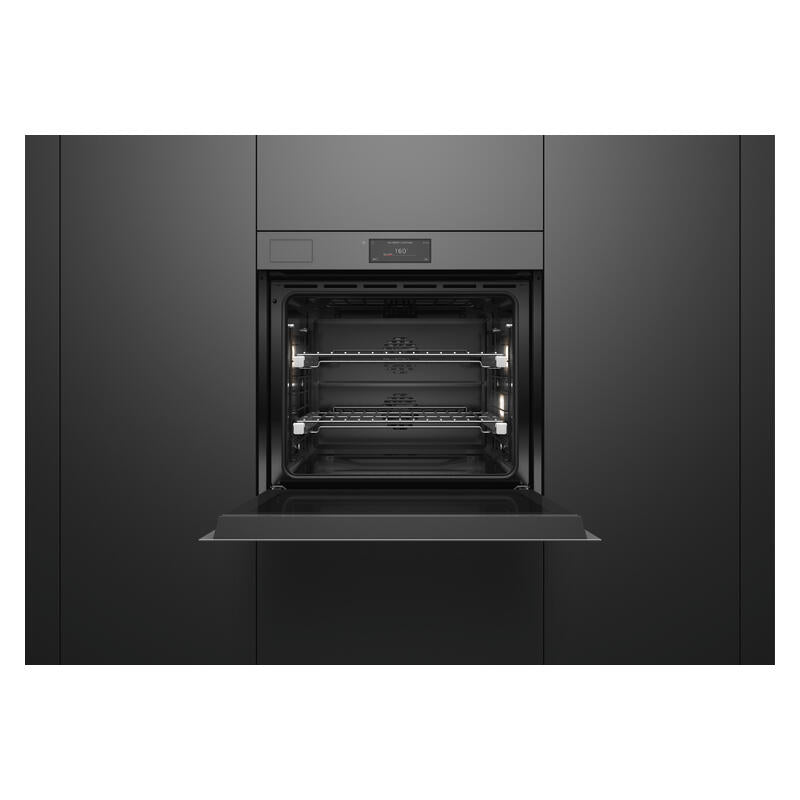 A built-in wall oven with its door open, showing the interior racks and light elements, set within dark charcoal kitchen cabinets.