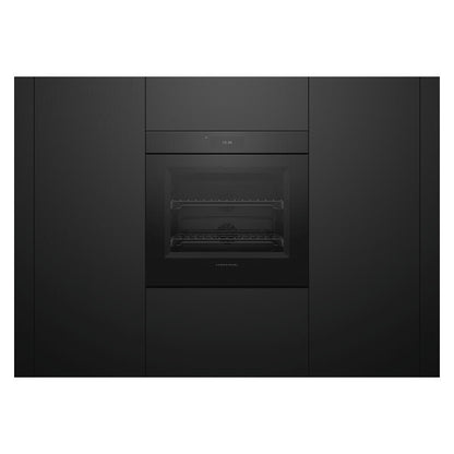 A sleek, black built-in oven or wall oven integrated into a matching black kitchen cabinet, shown against a white background.