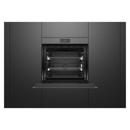 A built-in wall oven with its door open, showing the interior racks and light elements, set against a matching black kitchen cabinet background.