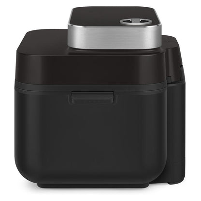 A sleek black countertop air fryer with a brushed silver metal top panel, photographed on a clean white background.