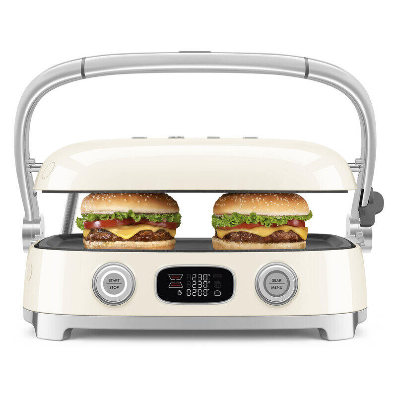 A cream-colored electric sandwich grill with a handle, shown with two burgers cooking inside on a clean white background.
