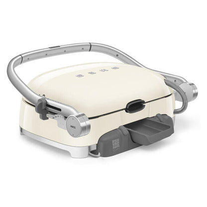 A retro-style electric grill in cream with a silver metal handle and base, and a dark gray drip tray, shown on a solid white background.