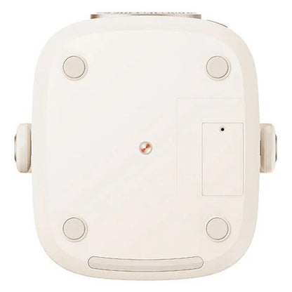 The underside of a square, off-white robotic vacuum cleaner, showing its feet, suction ports, and a small central sensor on a solid white background.