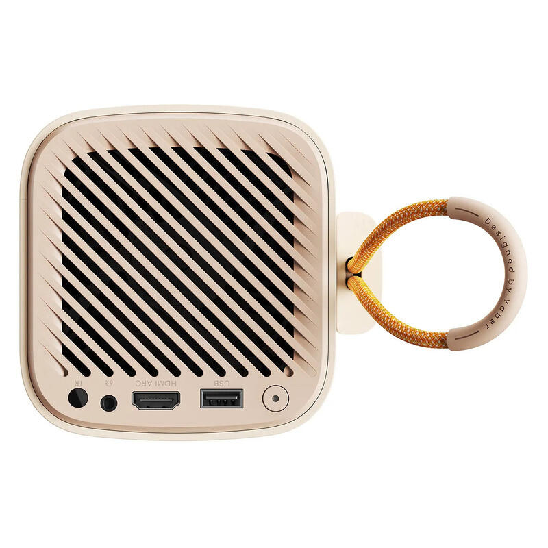 A square portable projector in a warm beige/cream color with a black diagonal grille pattern, featuring a braided yellow-orange carrying strap attached on the right side.